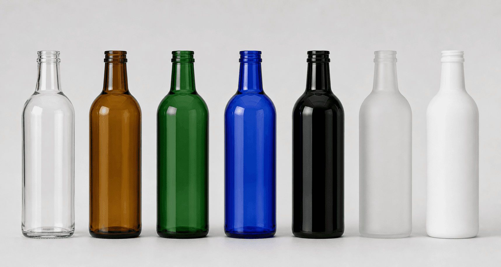 Glass bottles shown in clear, amber, green, cobalt, black, frosted and opal colors