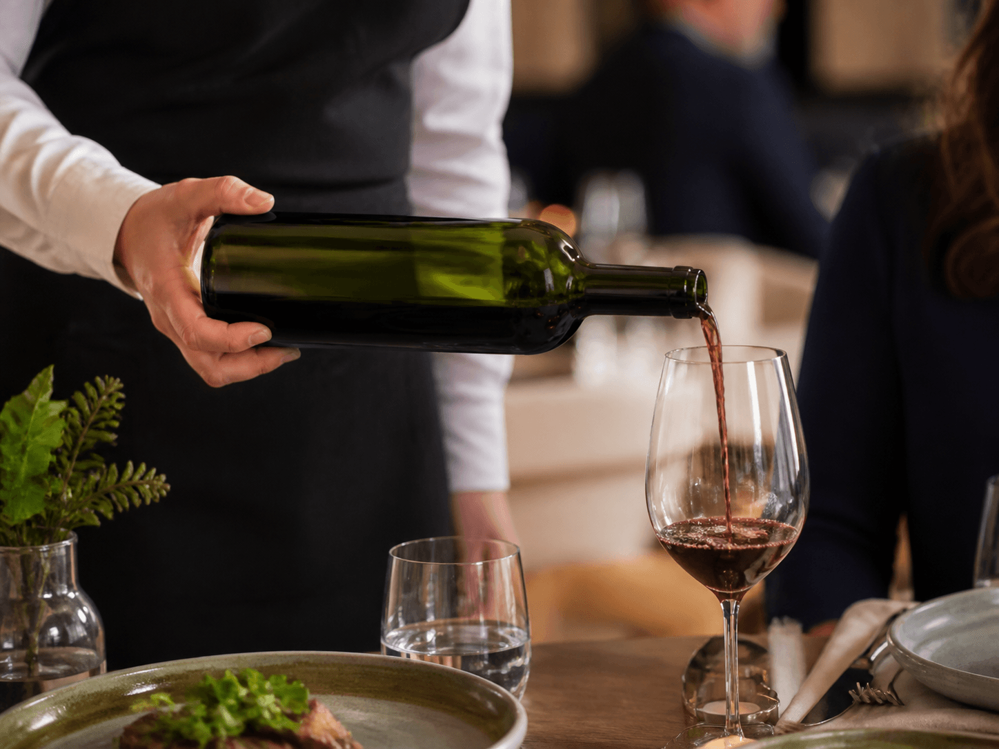 Bordeaux Bottle used for bottles poured at a table in a restaurant service setting