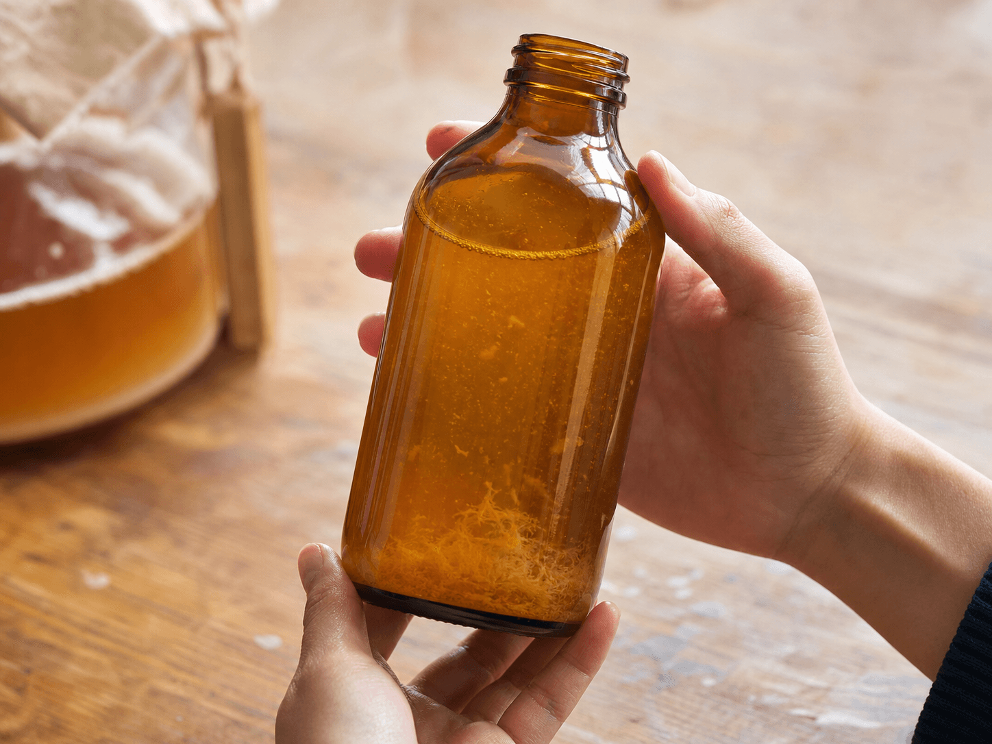 Kombucha Bottle used for sediment and strands customers may query in a live culture appearance setting