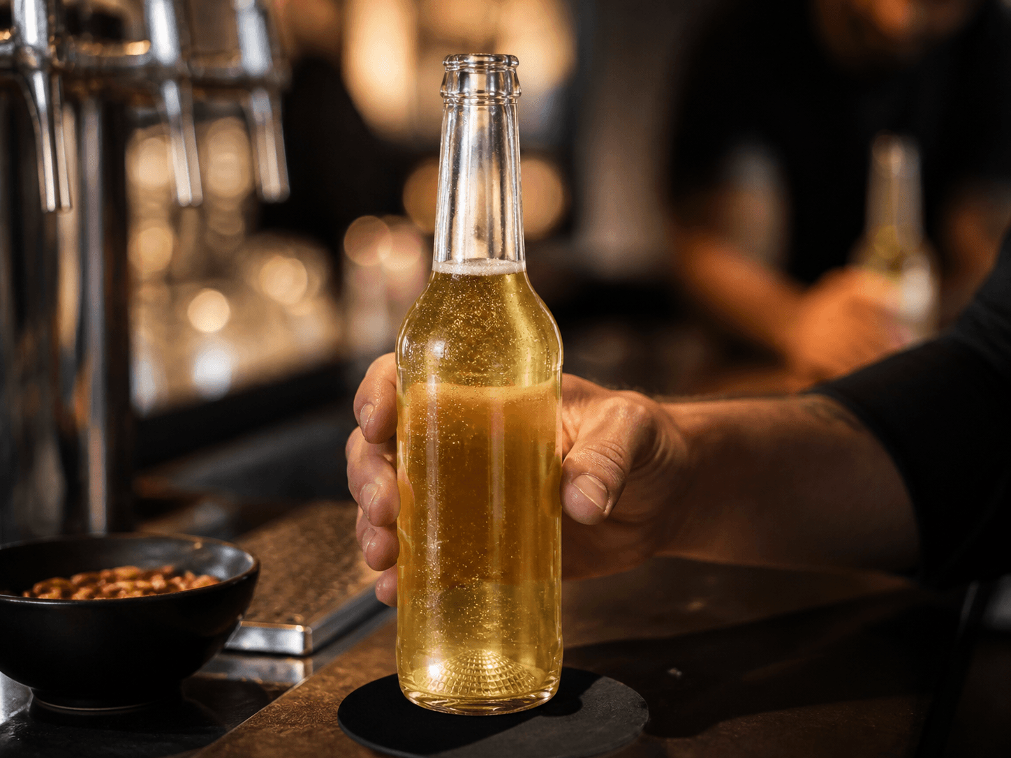 Nucleated-base Bottle used for lagers & carbonated beer served from the bottle in a beer setting