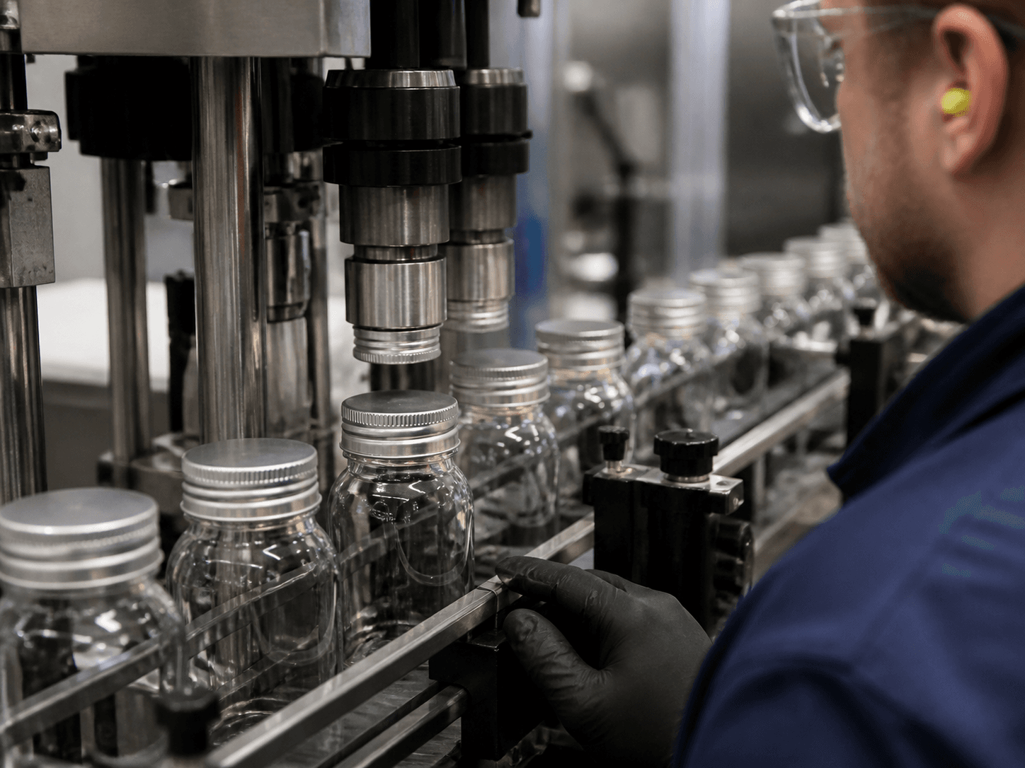Aluminum ROPP Cap used for caps formed onto bottles at line speed in a bottling halls setting