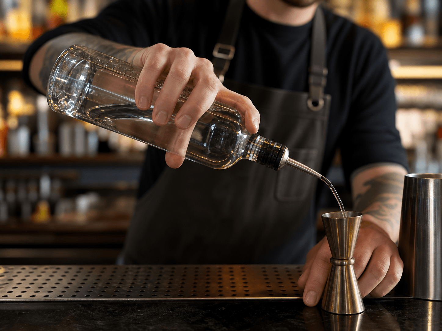 Pour Spout used for spirits poured repeatedly through a shift in a bar and restaurant service setting