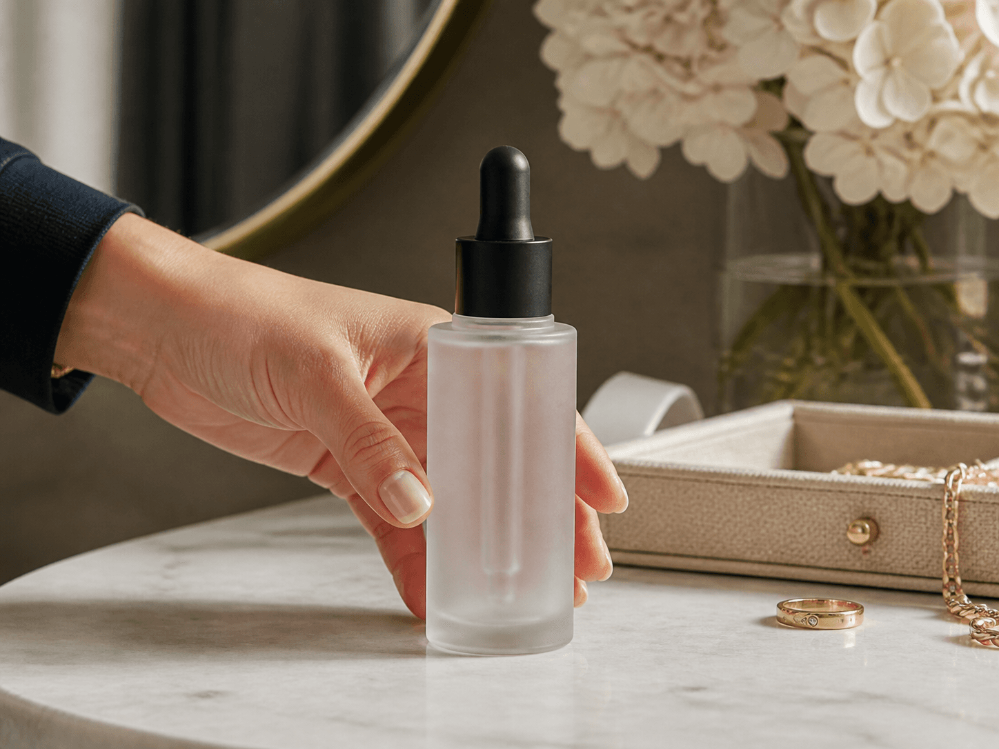 Refillable-insert Serum Bottle used for keepsake outer bottles in a premium retail setting