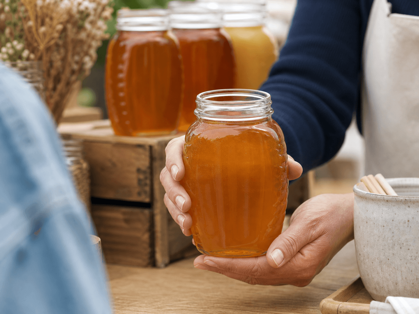 Queenline Honey Jar used for color-led apiary retail in a liquid varietal honey setting