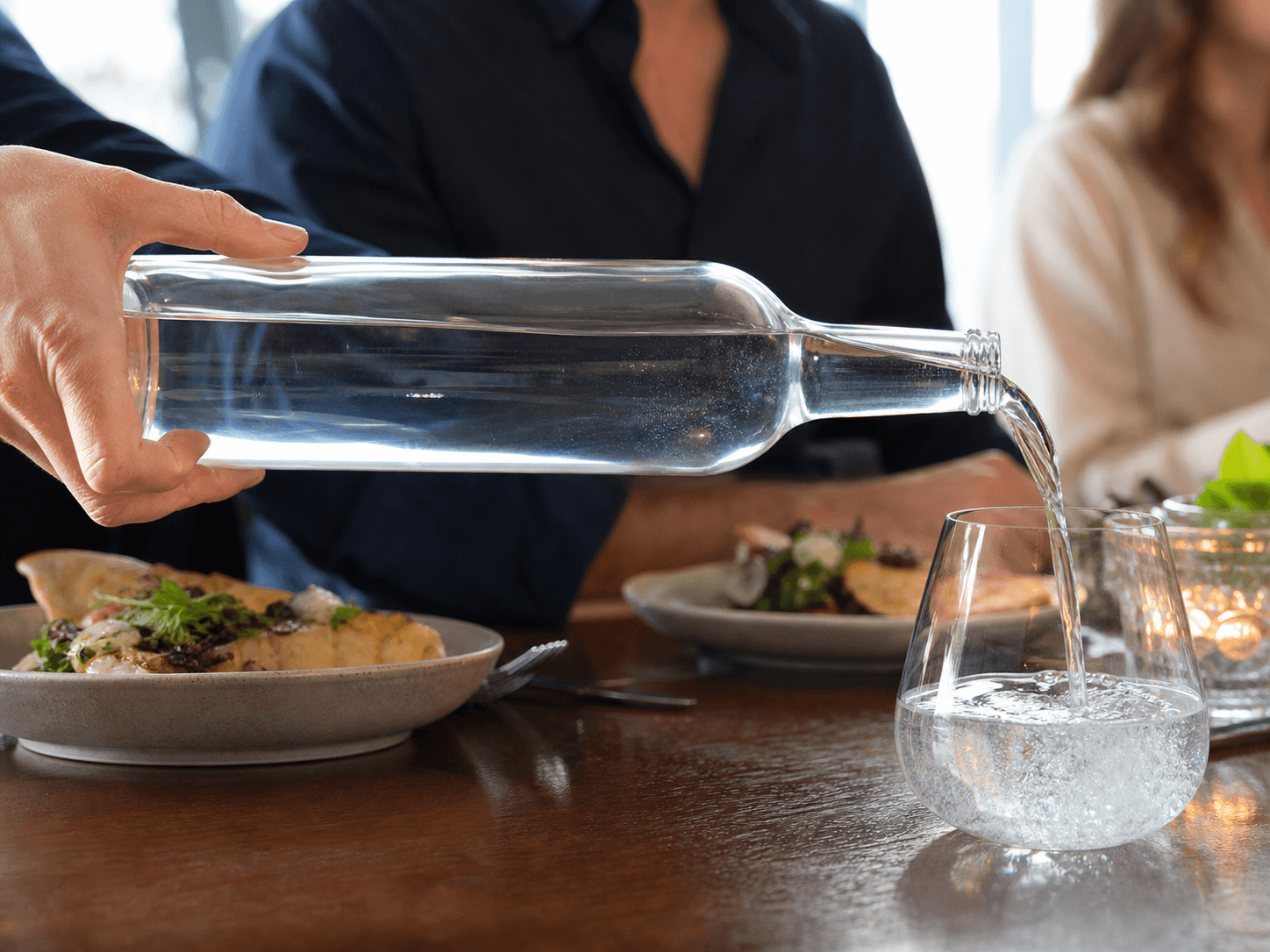 Sparkling Water Bottle used for bottles poured through a meal in a table service setting