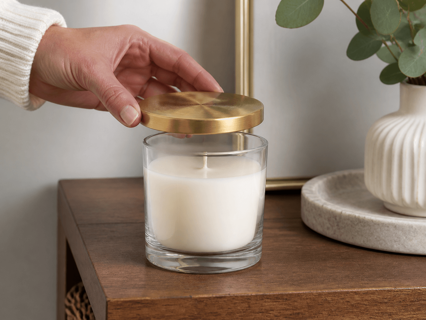 Brass / Brushed-metal Lid Vessel used for one lid finish across a collection in a range platform setting