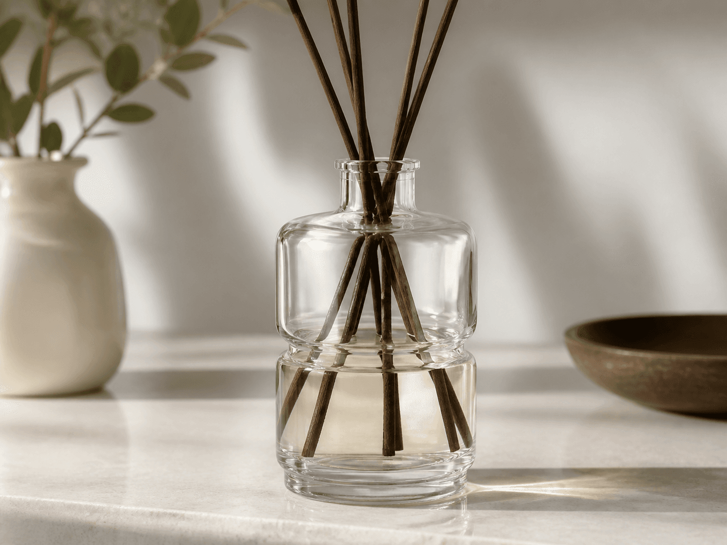 Layered Diffuser Bottle used for one silhouette across several fragrances in a range platform setting