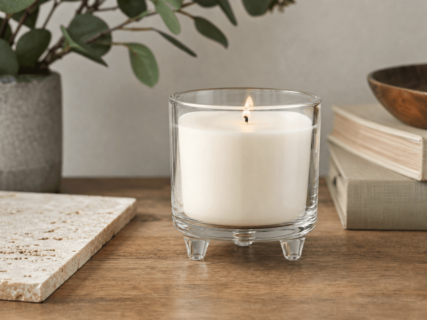 Three-legged Candle Jar used for candles standing on wood and stone in a furniture safety setting