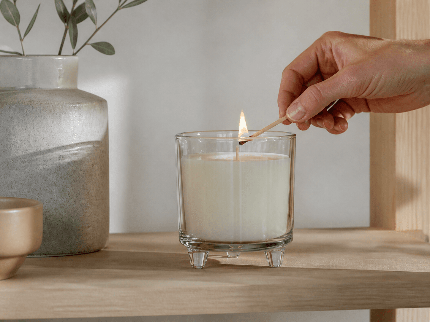 Three-legged Candle Jar used for elevated pieces on a shelf in a display setting