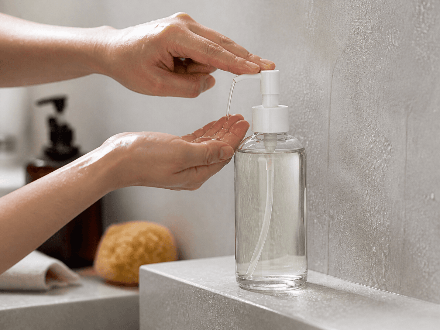 Cleansing Oil Bottle used for wet-hand and shower use in a bathroom reality setting