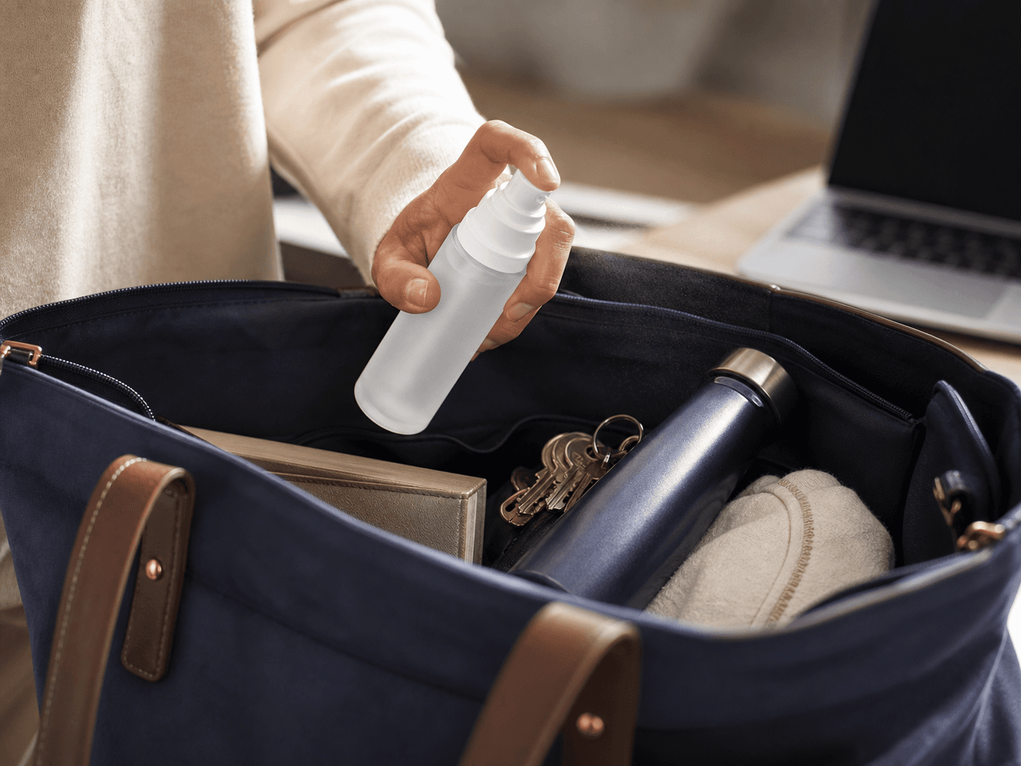 Cosmetic Spray Bottle used for a mist that travels with someone all day in a handbags and gym bags setting