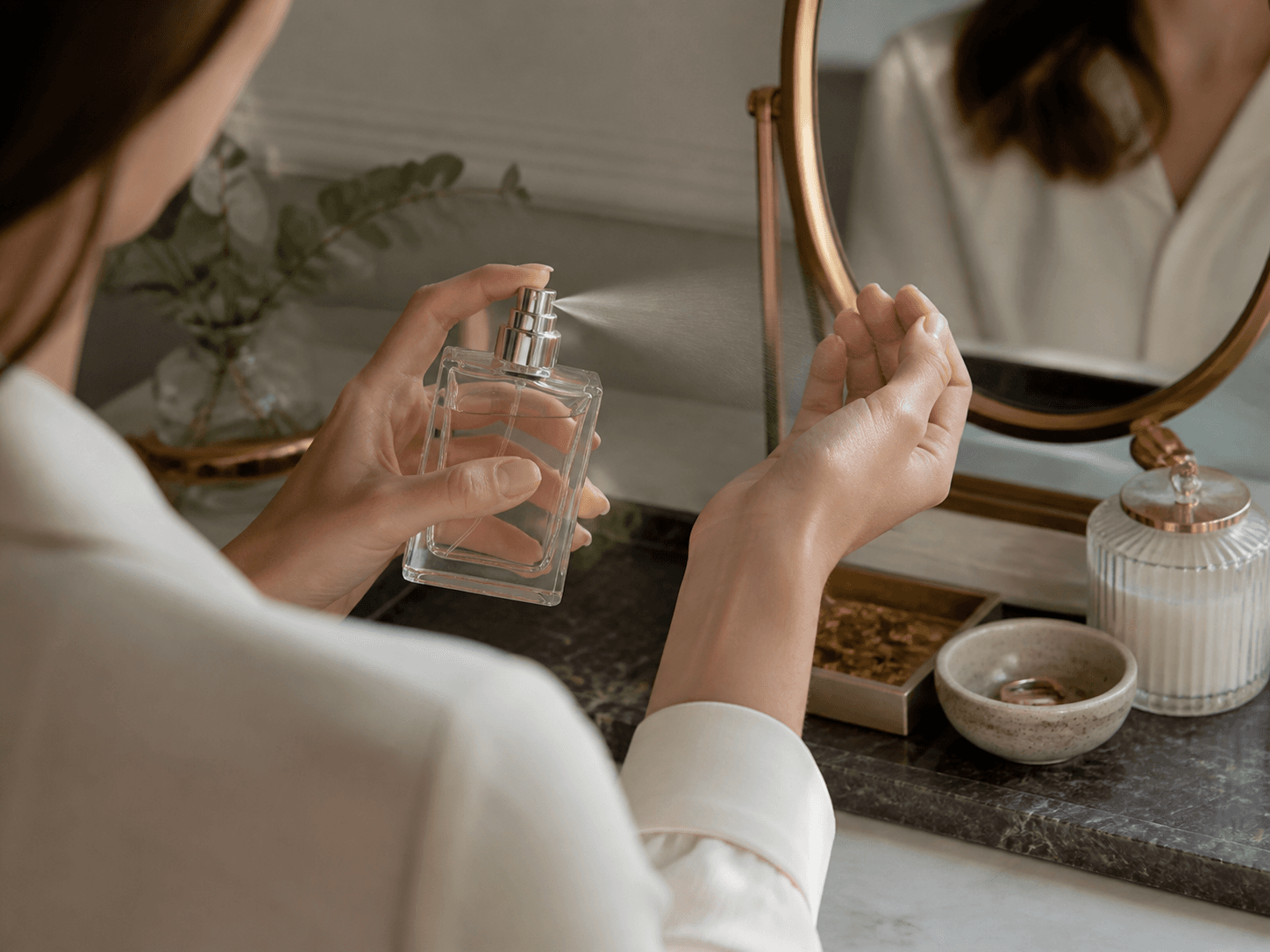 Perfume Spray Bottle used for signature scents on a dresser in a fine fragrance setting