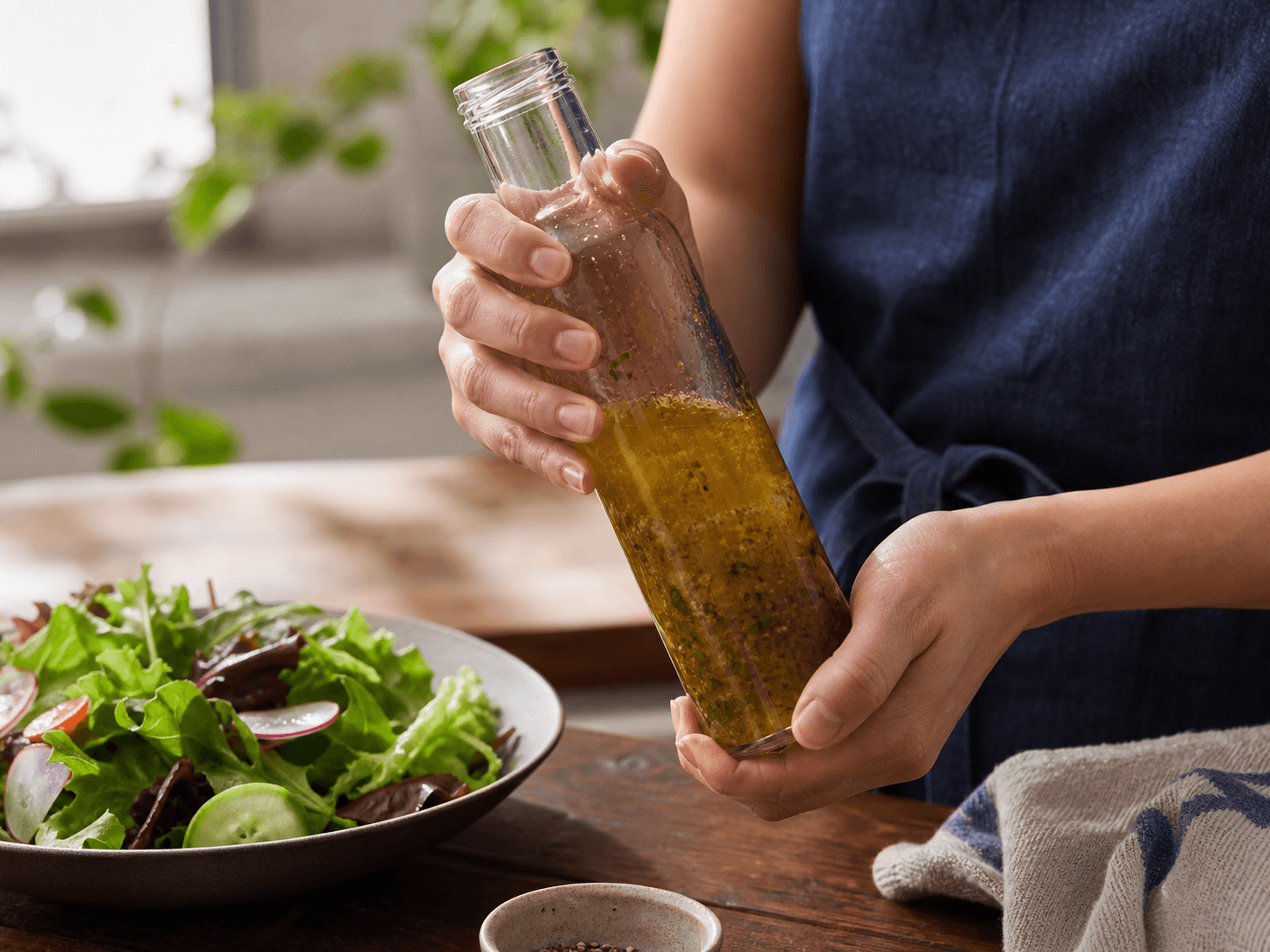 Salad Dressing Bottle used for oil-and-vinegar vinaigrettes in a separated formula setting