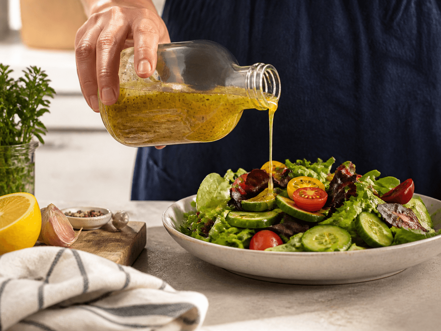 Stout Round Bottle used for dressings and pourable marinades in a emulsified product setting