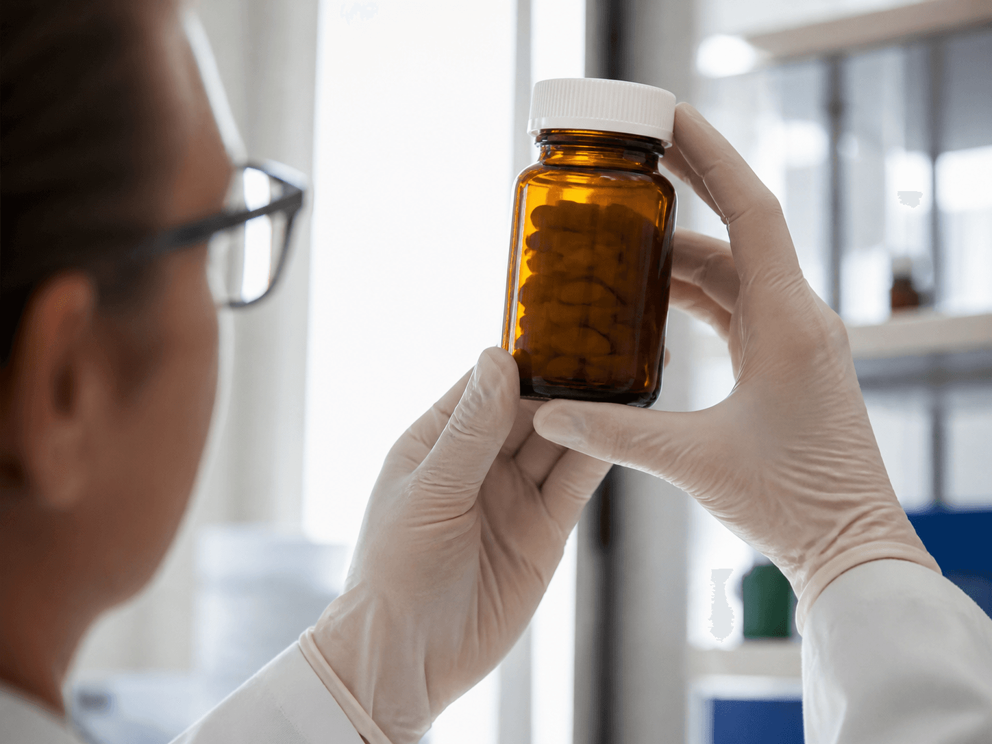 Vitamin Bottle used for an ingredient panel held up to the light in a customers reading the back setting